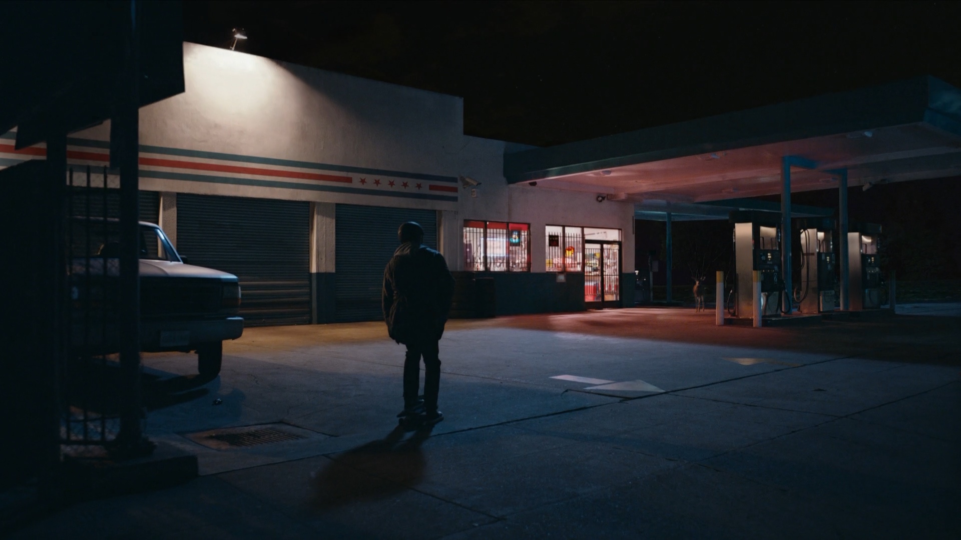 The same location with signage removed and graphic stripes added.