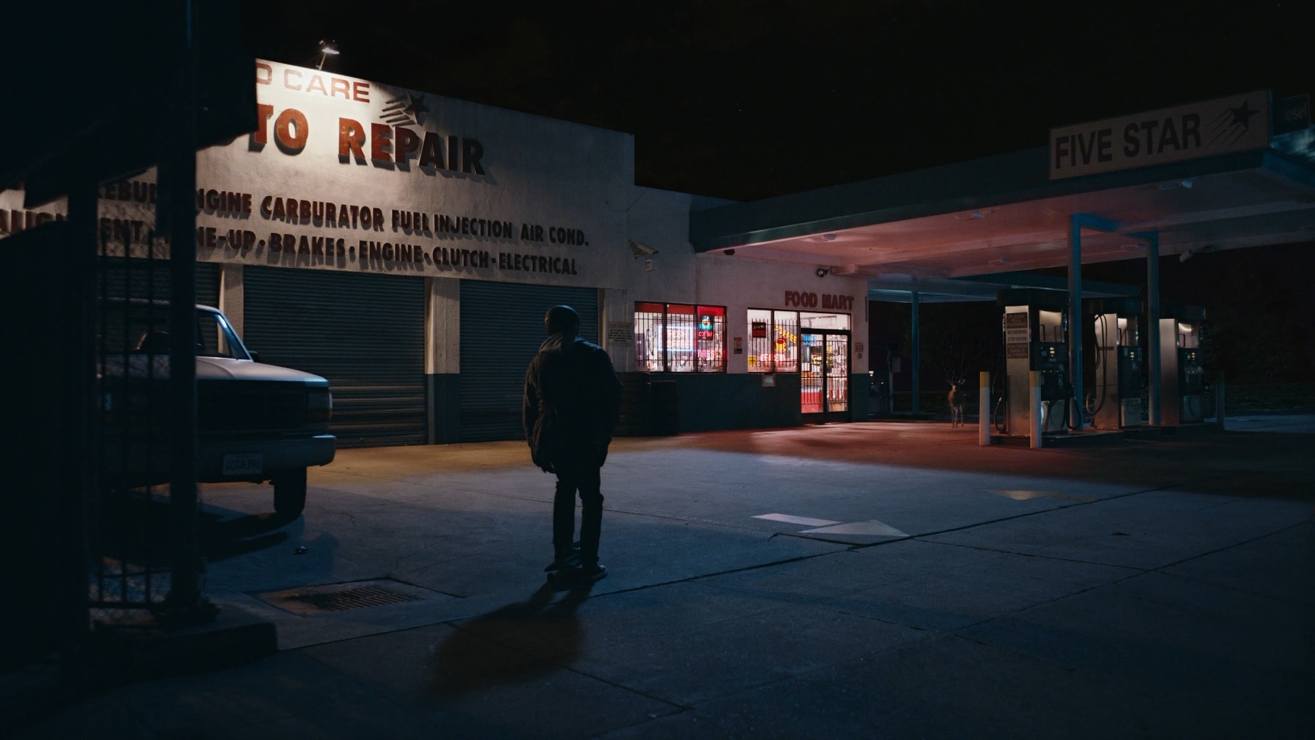 Signage on the garage and storefront before adaptation.